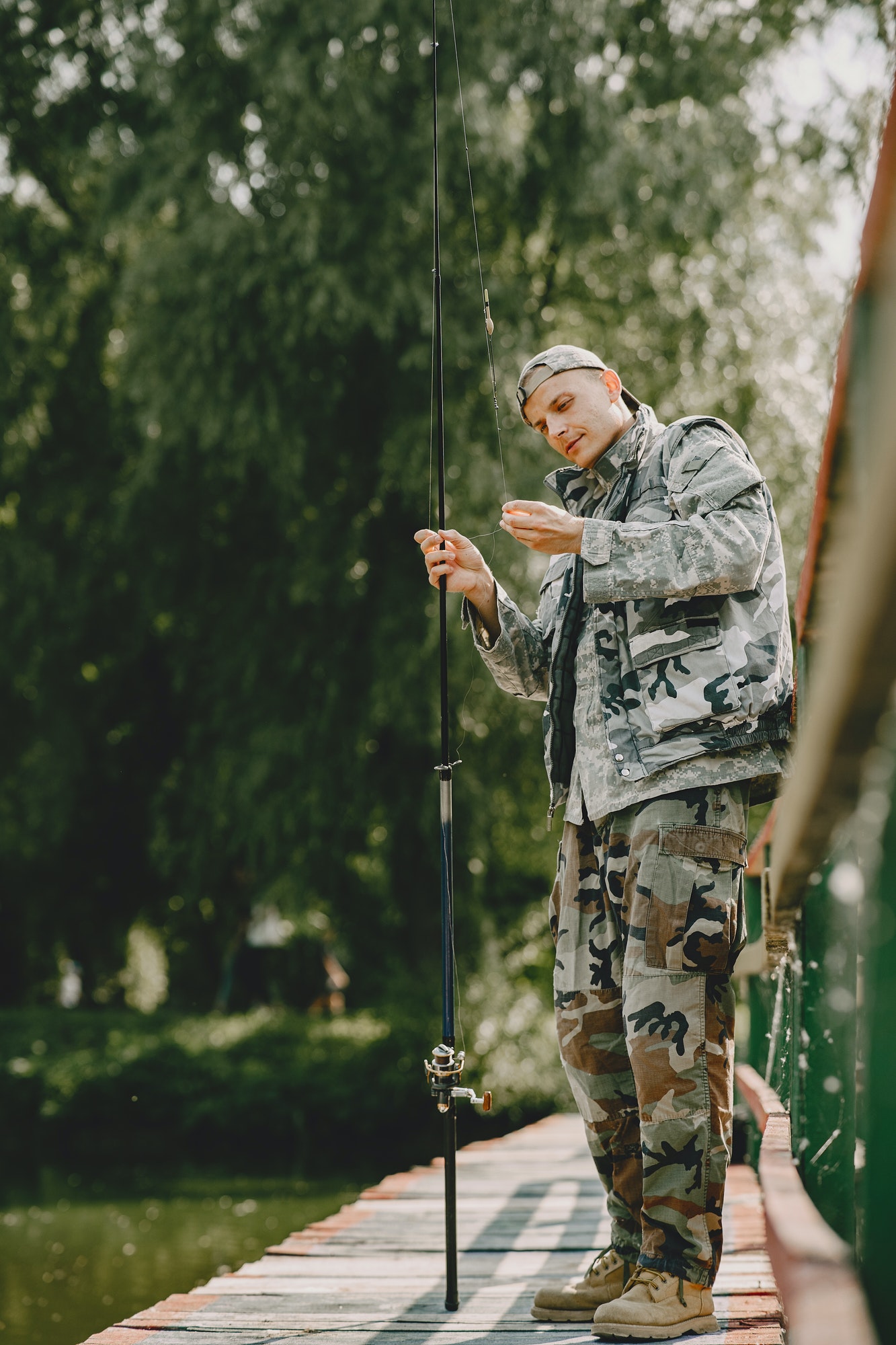 man fishing and holds the angling rod 1