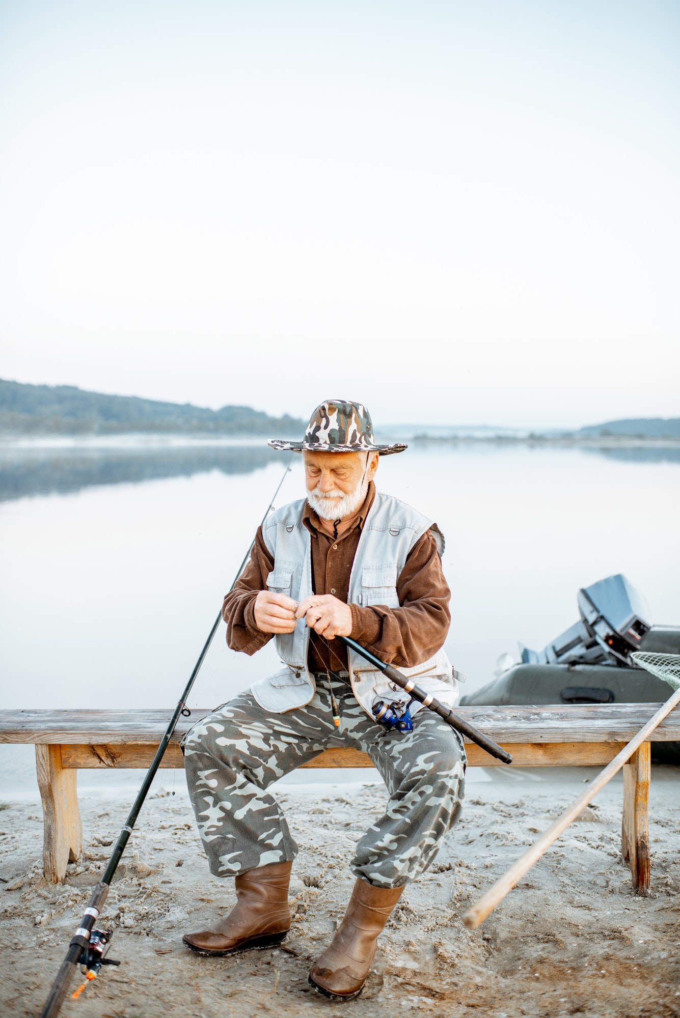 senior man fishing on the lake